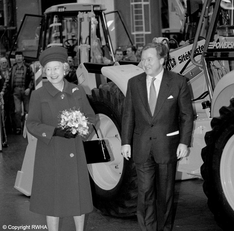 HM Queen Elizabeth pictured with Lord Bamford during a visit to JCB in 1995