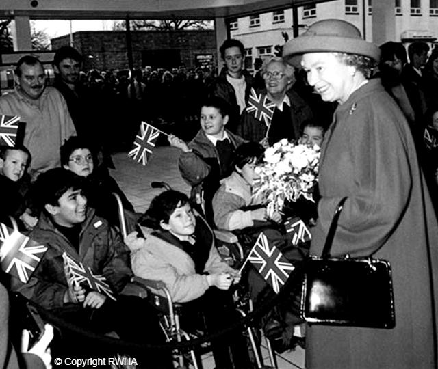 The Queen meets local children during her visit to Jaguar Land Rover in 1994.