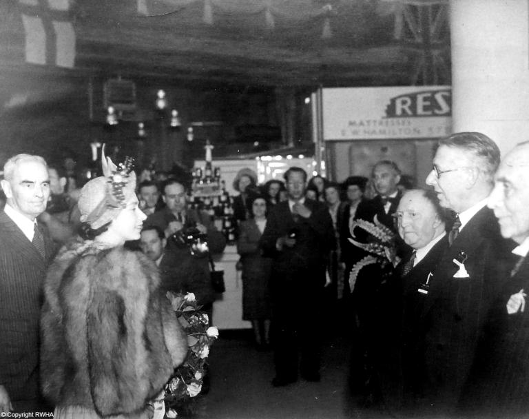 The Queen, then Princess Elizabeth, visits an exhibition in Belfast with Ulster Carpets in 1949.